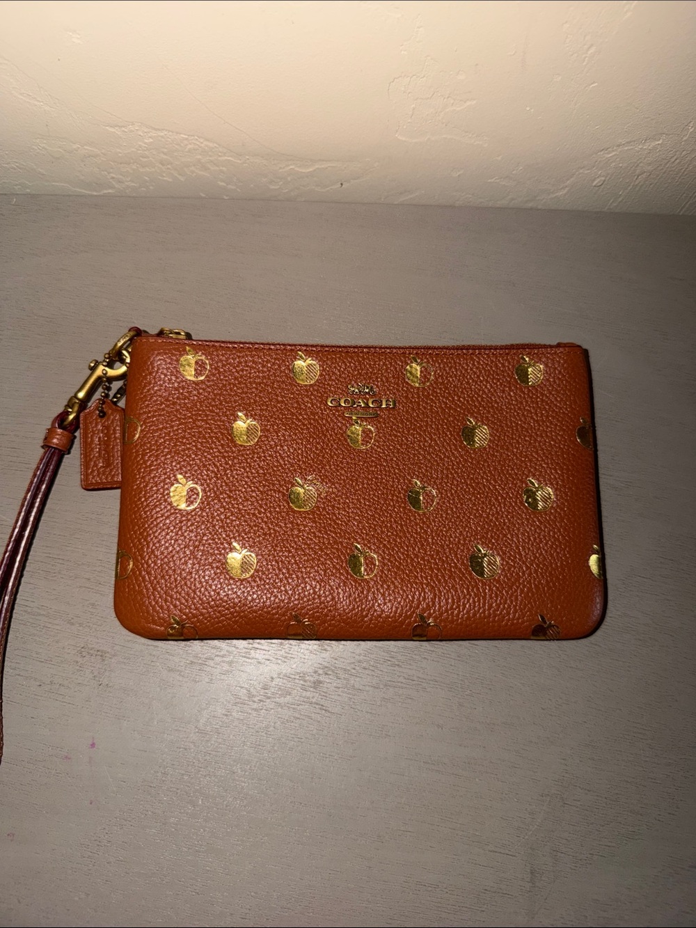 Coach Brown Pebbled Leather Wristlet with Gold Apple Accents